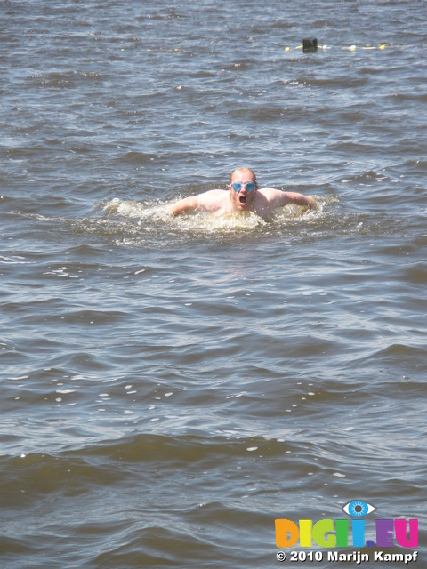 JT00982 Marijn attempting butterfly stroke in lake 'De Fluezen' from Indijk, The Netherlands